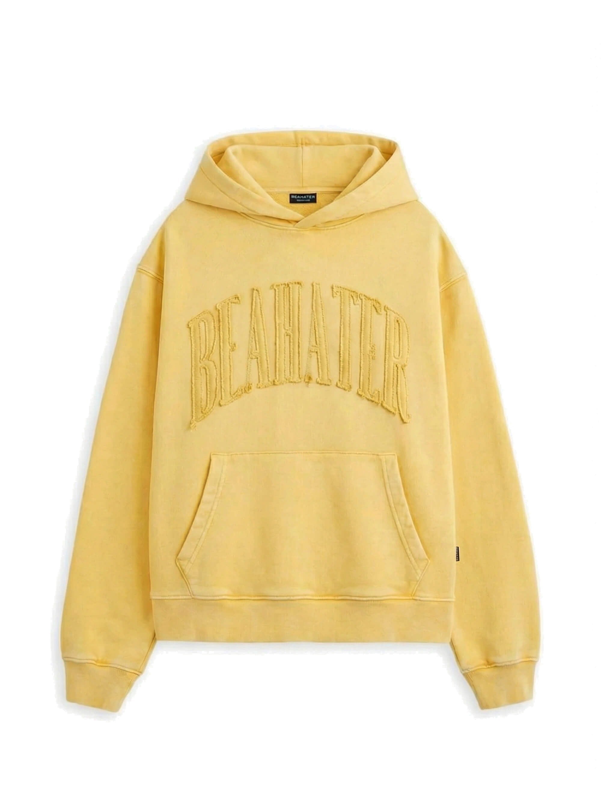 Oversized hoodie in mosterdgeel, garment-dyed washed finish, voorzijde met arch-borduursel